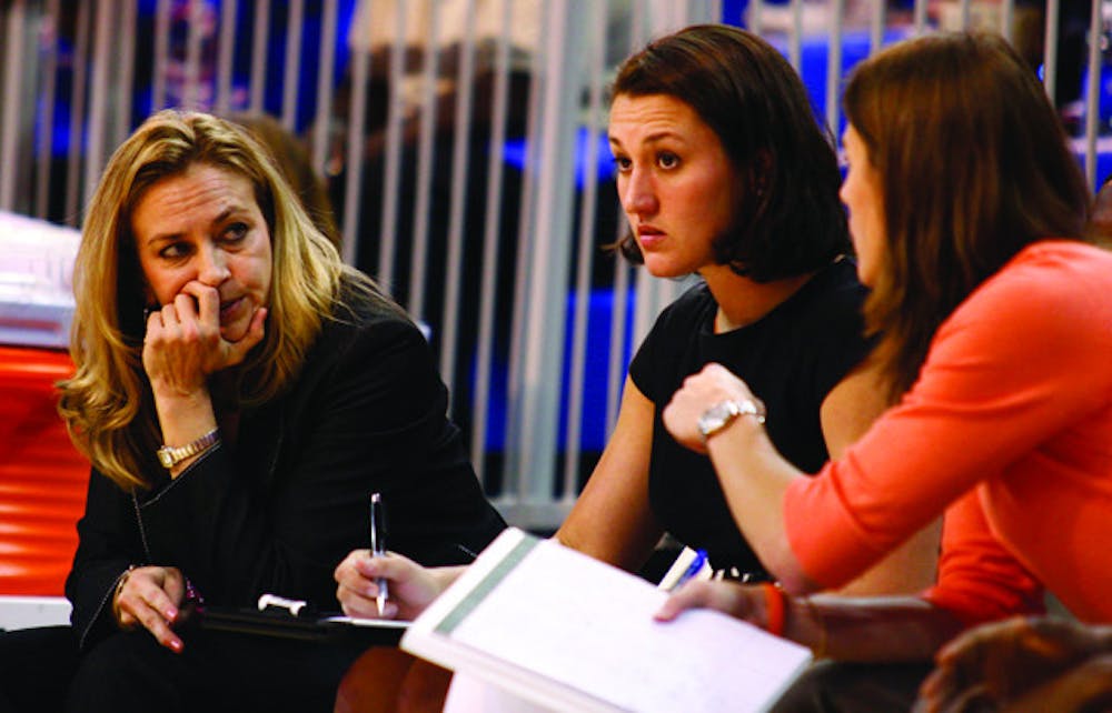 <p>Florida coach Amanda Butler (left) has a 20-32 record on the road since taking the job in 2007, including a 7-15 mark against nonconference teams.</p>