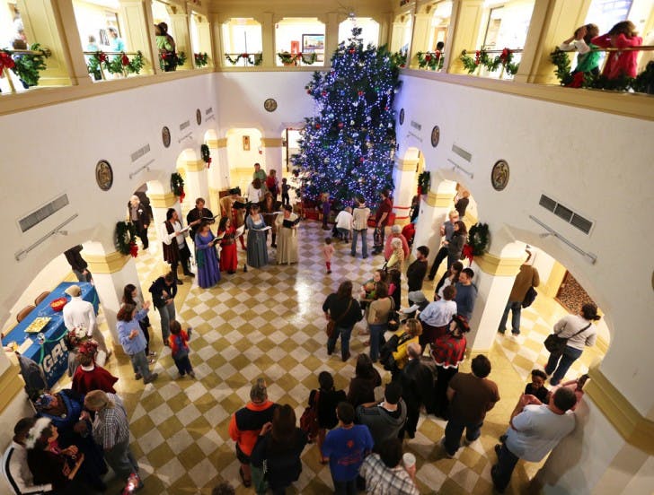 Gainesville residents gather as Mayor Craig Lowe lights the city Christmas tree Saturday night at the Thomas Center. The Holiday Tree Lighting Celebration was free and open to the public.
