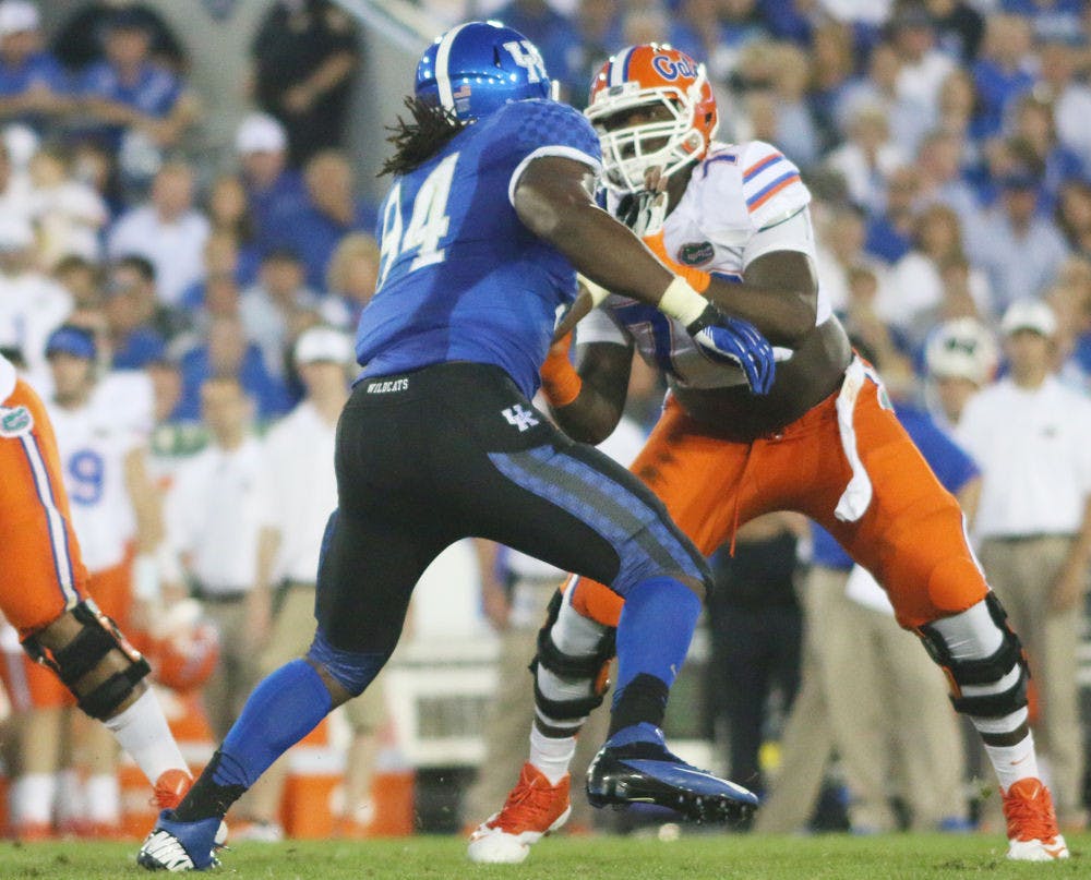 <p>Florida left tackle D.J. Humphries blocks Kentucky defensive end Za'Darius Smith (94) during the Gators' 24-7 win against the Wildcats on Sept. 28 in Lexington, Ky.</p>