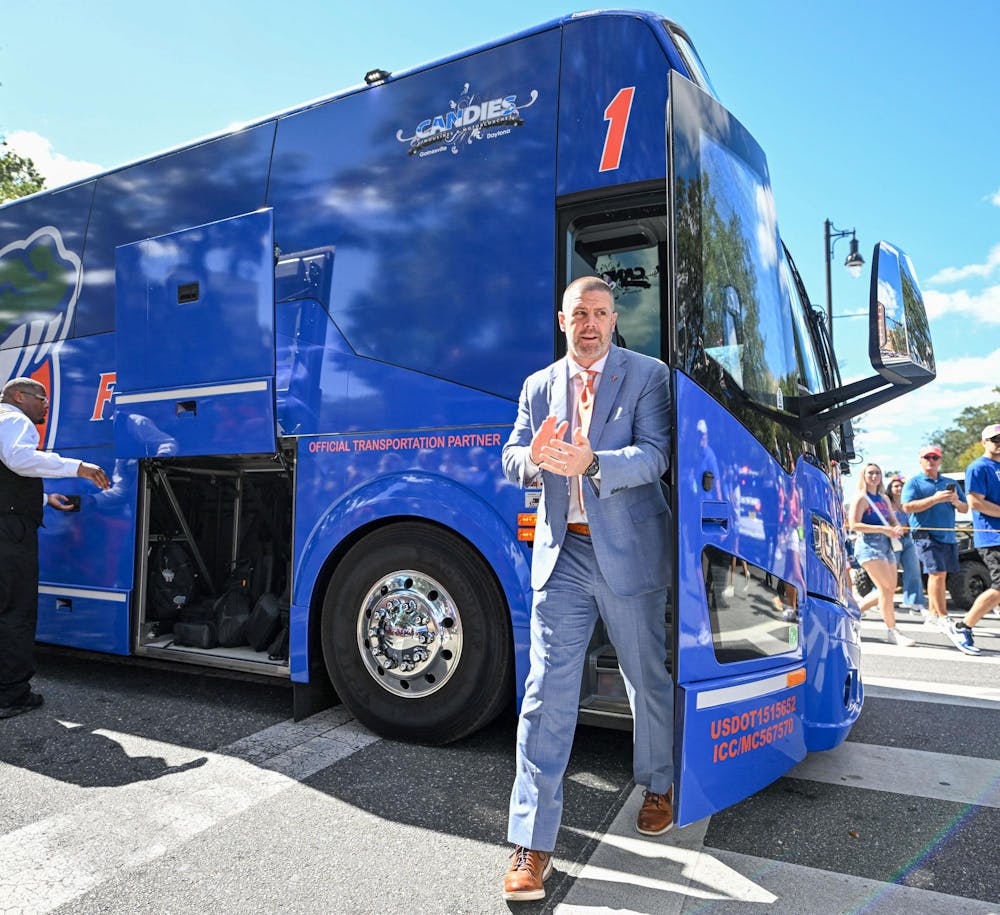 Florida Gators head coach Billy Napier walks off the bus at Gator Walk before a NCAA college football game, Saturday, Oct. 18, 2025, in Gainesville, Fla.