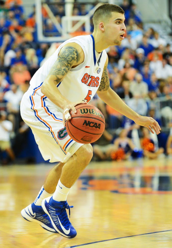 Point guard Scottie Wilbekin looks for an opening into the lane during Florida’s 77-44 win against Georgia on Jan. 9 in the O’Connell Center. Wilbekin was suspended last week for violating team rules. 