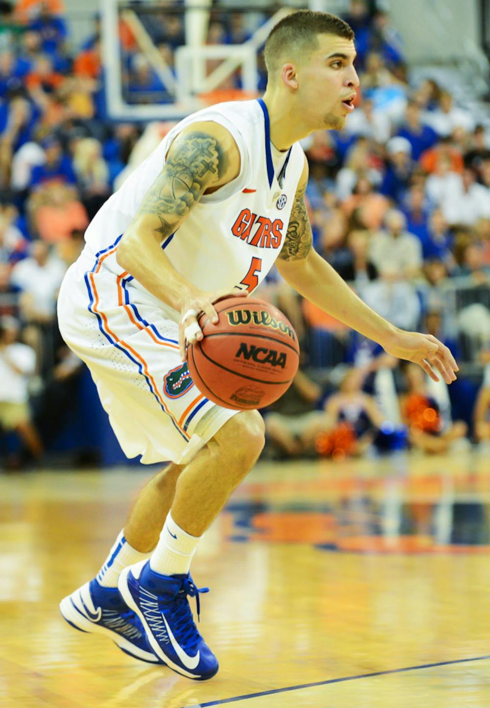 <p>Point guard Scottie Wilbekin looks for an opening into the lane during Florida’s 77-44 win against Georgia on Jan. 9 in the O’Connell Center. Wilbekin was suspended last week for violating team rules. </p>