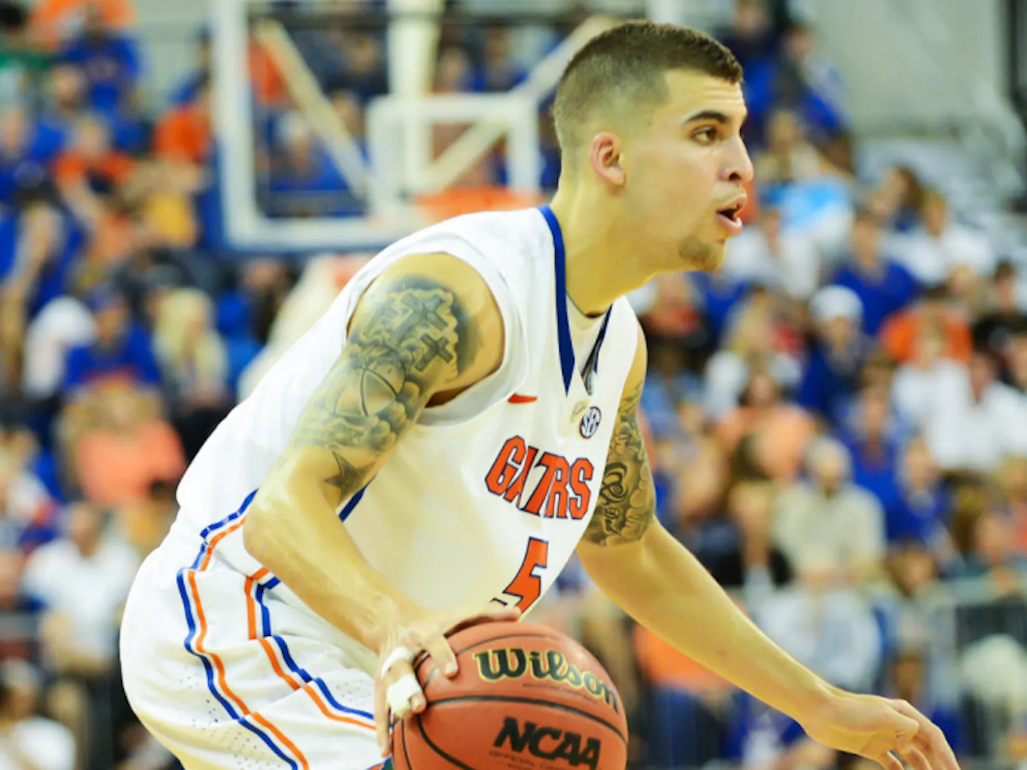 Point guard Scottie Wilbekin looks for an opening into the lane during Florida’s 77-44 win against Georgia on Jan. 9 in the O’Connell Center. Wilbekin was suspended last week for violating team rules.
