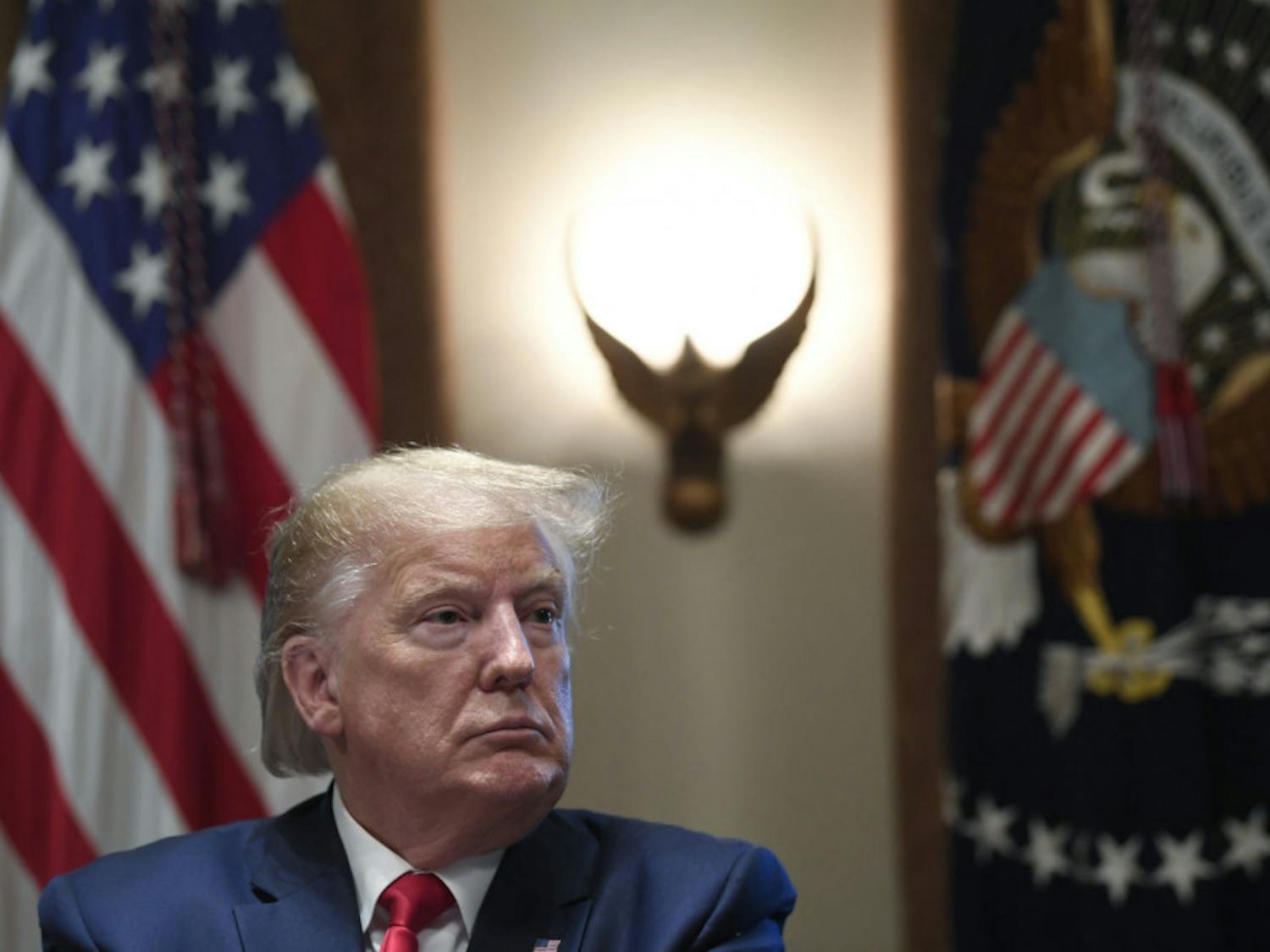 President Donald Trump listens during a meeting in the Cabinet Room of the White House in Washington, Friday, Nov. 22, 2019, on youth vaping and the electronic cigarette epidemic. (AP Photo/Susan Walsh)