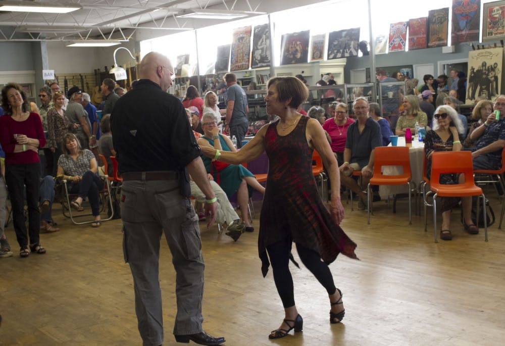 Carol Perrine (far left) watches as two of her friends dance at the Carolpalooza&nbsp;benefit concert.
&nbsp;