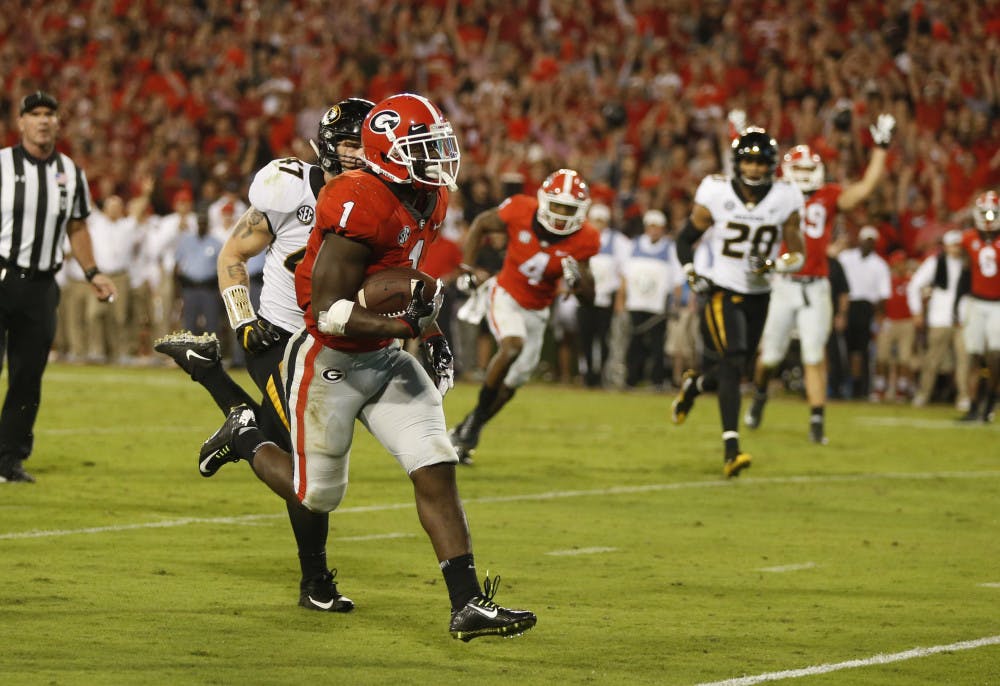 Georgia running back Sony Michel (1) out runs Missouri linebacker Cale Garrett (47) to score a touchdown during the second half of an NCAA college football game Saturday, Oct. 14, 2017, in Athens, Ga. Georgia won 53-28. (AP Photo/John Bazemore)