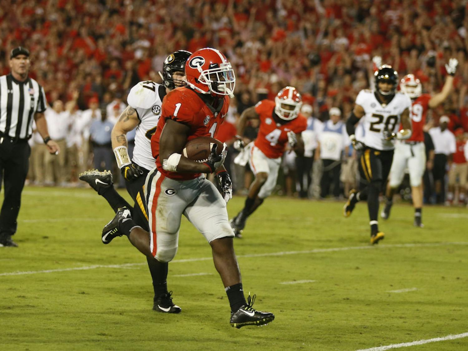 Georgia running back Sony Michel (1) out runs Missouri linebacker Cale Garrett (47) to score a touchdown during the second half of an NCAA college football game Saturday, Oct. 14, 2017, in Athens, Ga. Georgia won 53-28. (AP Photo/John Bazemore)