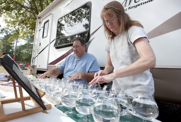 Eric and Susan Scites practice the glass harp Wednesday afternoon in preparation for the opening of the Hoggetowne Medieval Faire. Eric, 49, and his wife, Susan, 47, travel the country demonstrating the instrument.