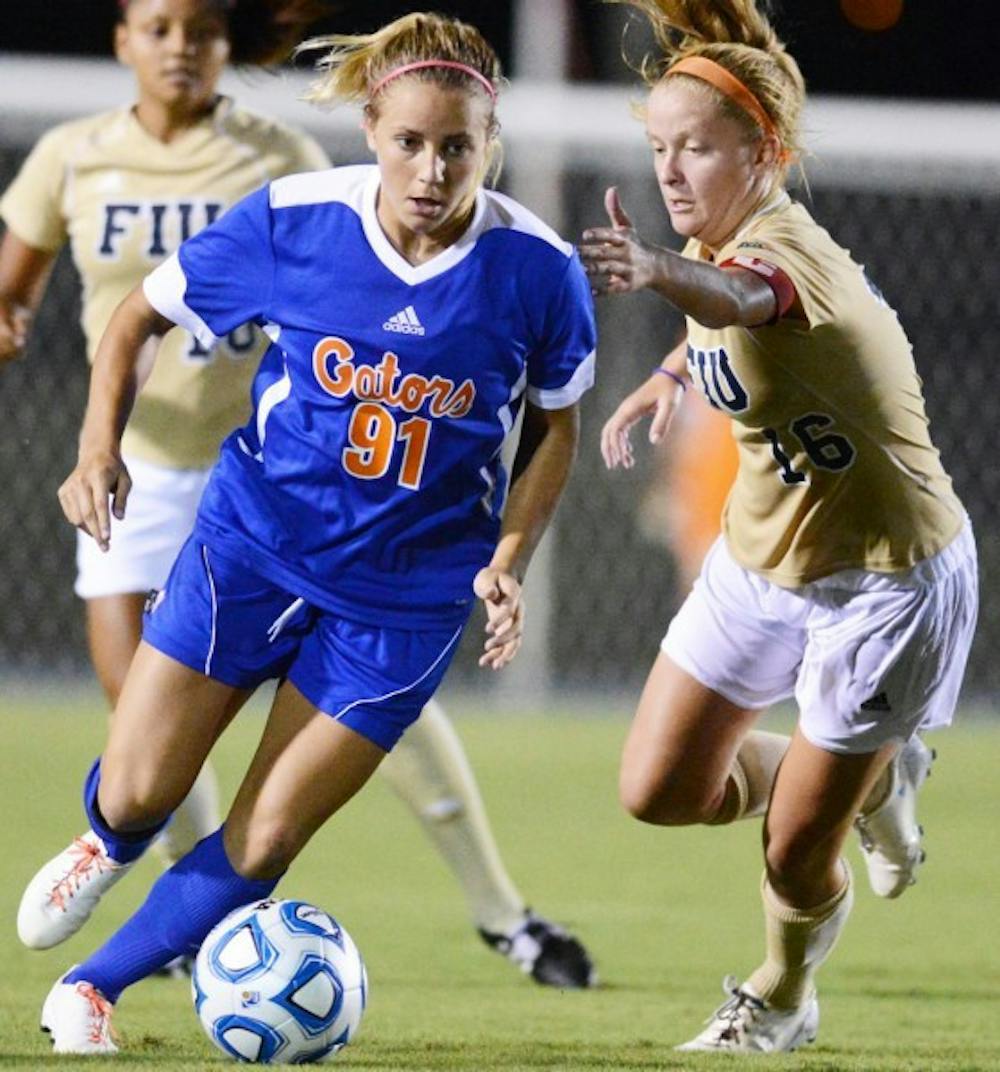 <p>Adriana Leon (91) gets past Nicole Diperna (16) of Florida International University during UF's 3-0 win on Sept. 2. Leon scored the game-winning goal in overtime against Auburn on Sunday at the AU Soccer Complex.</p>