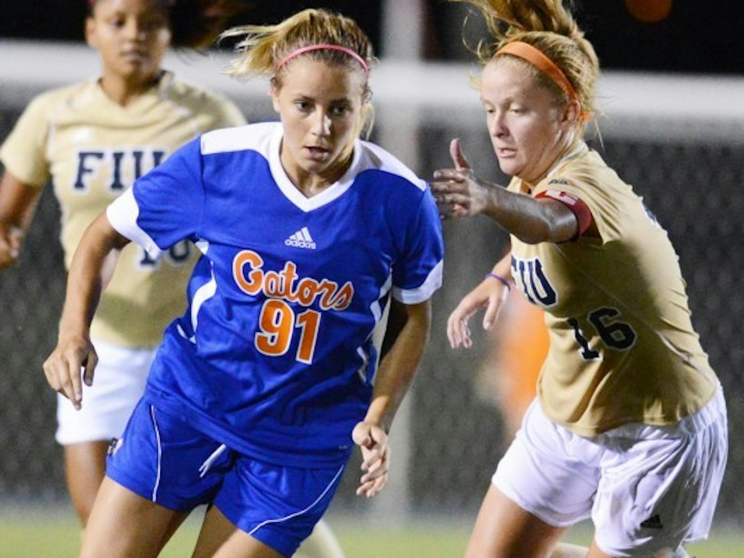Adriana Leon (91) gets past Nicole Diperna (16) of Florida International University during UF's 3-0 win on Sept. 2. Leon scored the game-winning goal in overtime against Auburn on Sunday at the AU Soccer Complex.