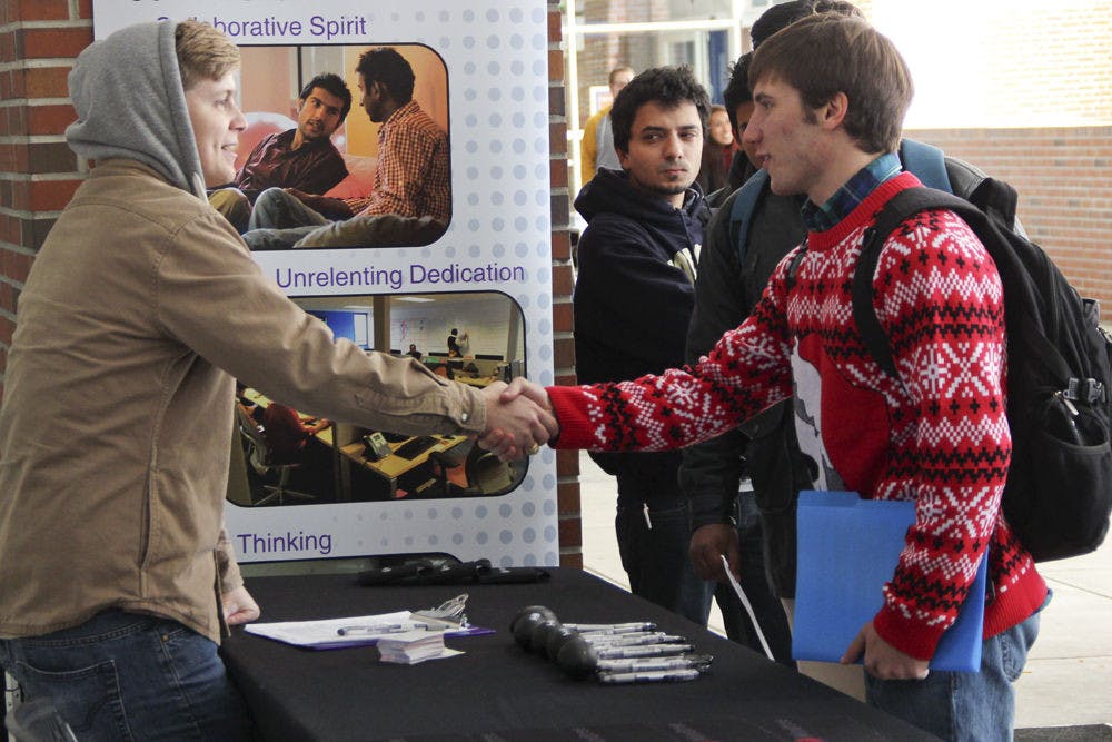 From right, Troy Halpin, a 20-year-old UF computer engineering sophomore meets Mindtree’s talent coordinator Rob Stolle, 28, at the Startup Job and Internship Fair on Tuesday afternoon.&nbsp;