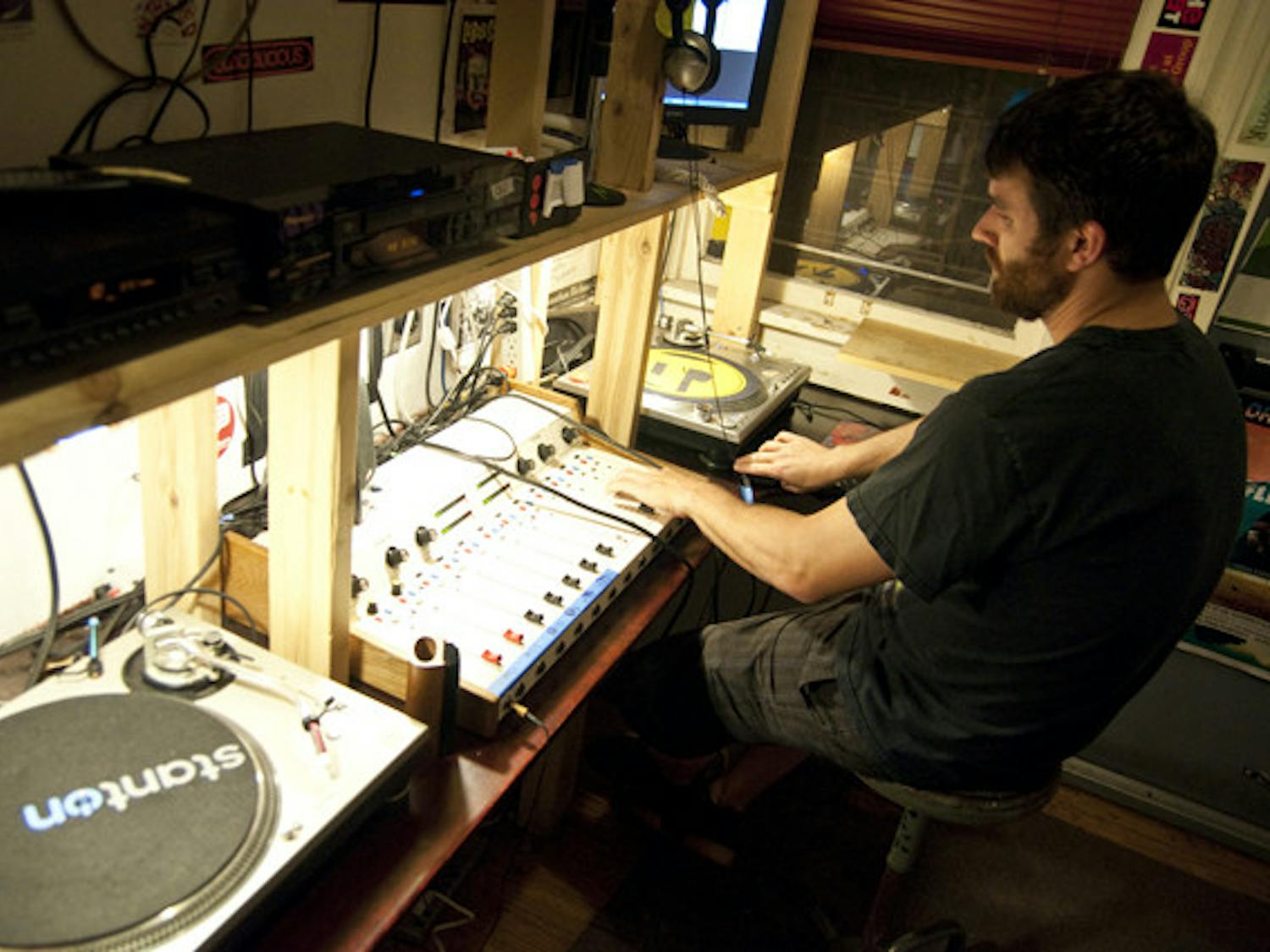 UF business graduate Dave Newell DJs his Thursday night hip-hop radio show, "Enjoy the Silence," in Grow Radio's studio, located downtown.