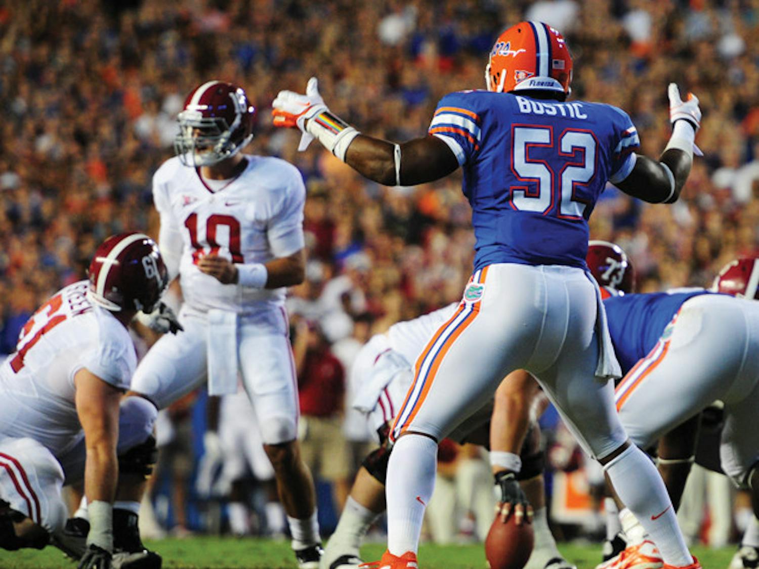 Florida linebacker Jon Bostic (52) will not be suspended by coach Will Muschamp for throwing a punch at Alabama offensive lineman D.J. Fluker during the second quarter Saturday.