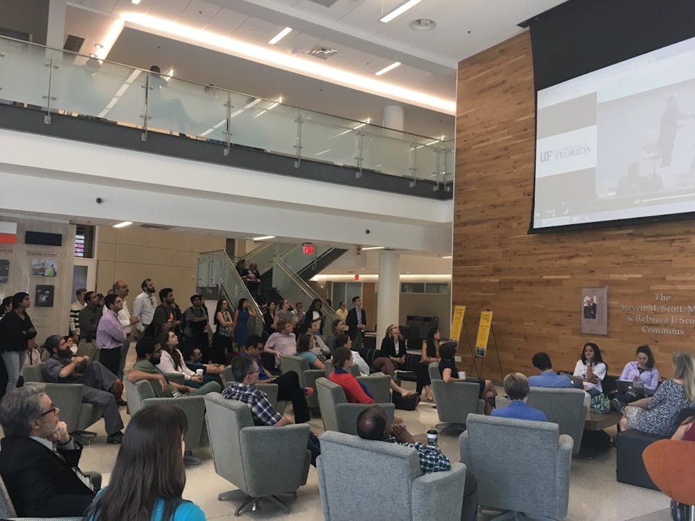 <p>About 250 people watch a livestream of National Institutes of Health Director Dr. Francis Collins speak to UF students and faculty in the North Learning Studies Room of the Harrell Medical Education Building Monday morning. Collins spoke about the importance of funding STEM research.</p>