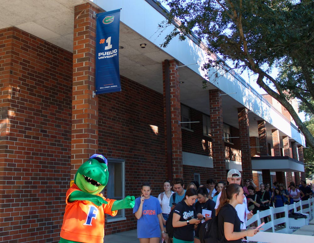 Students wait in line under the new #1 Public University banner outside of Emerson Alumni Hall on Friday, Sept. 15, 2023.