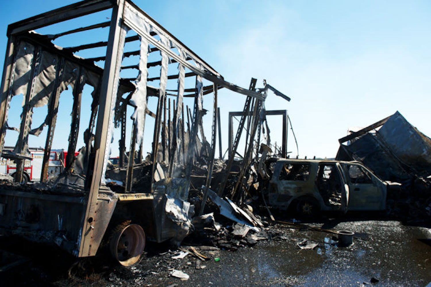 The charred wreckage of a semitrailer and an SUV sit on Interstate 75 in Paynes Prairie Preserve State Park on Jan. 29, 2012. Today marks the one-year anniversary of the accident that claimed the lives of 11.