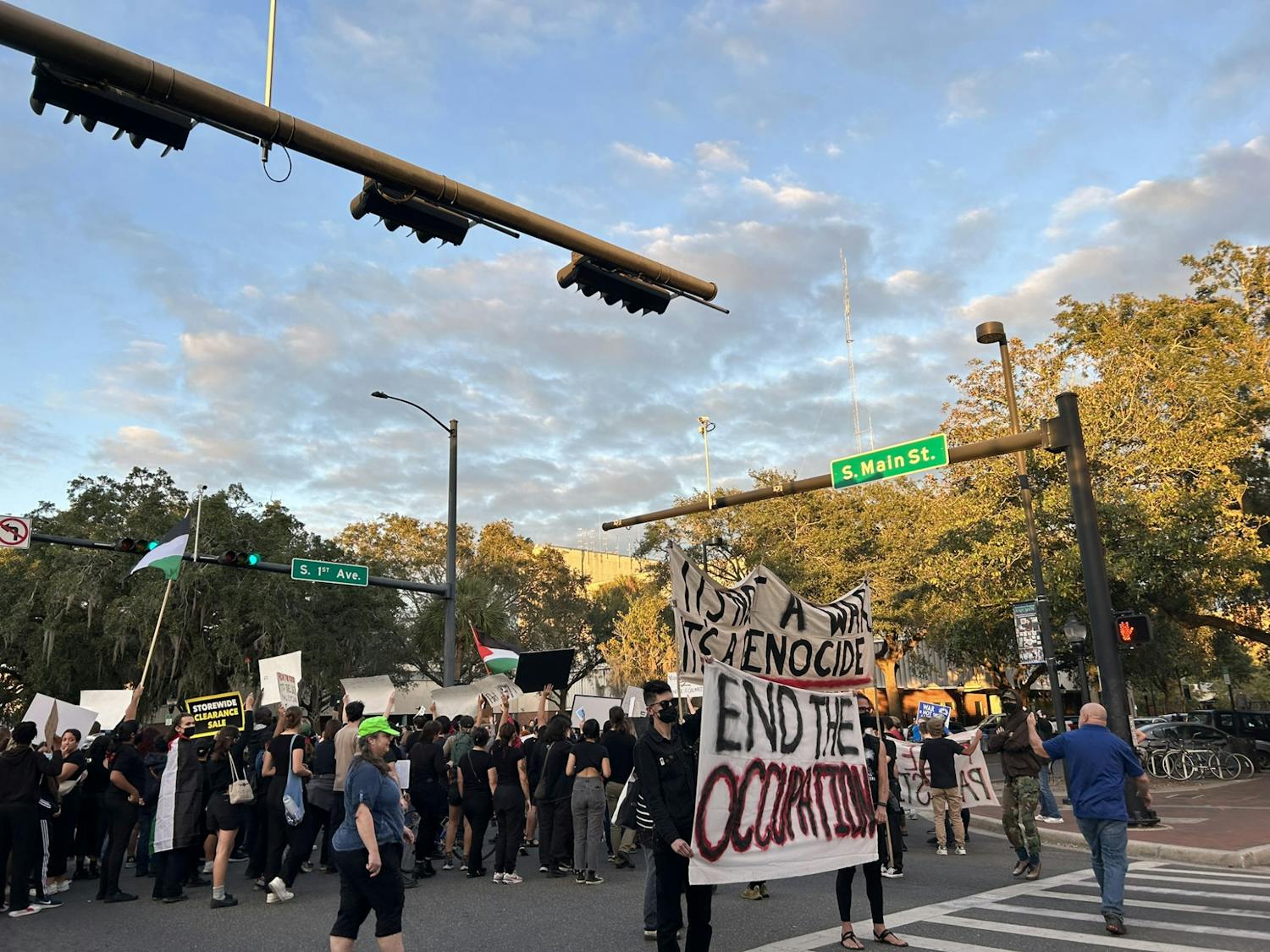 A crowd of 150 pro-Palestinian protestors stand in the middle of the intersection chanting in unison for an end to the siege of Gaza Saturday, November 4, 2023.