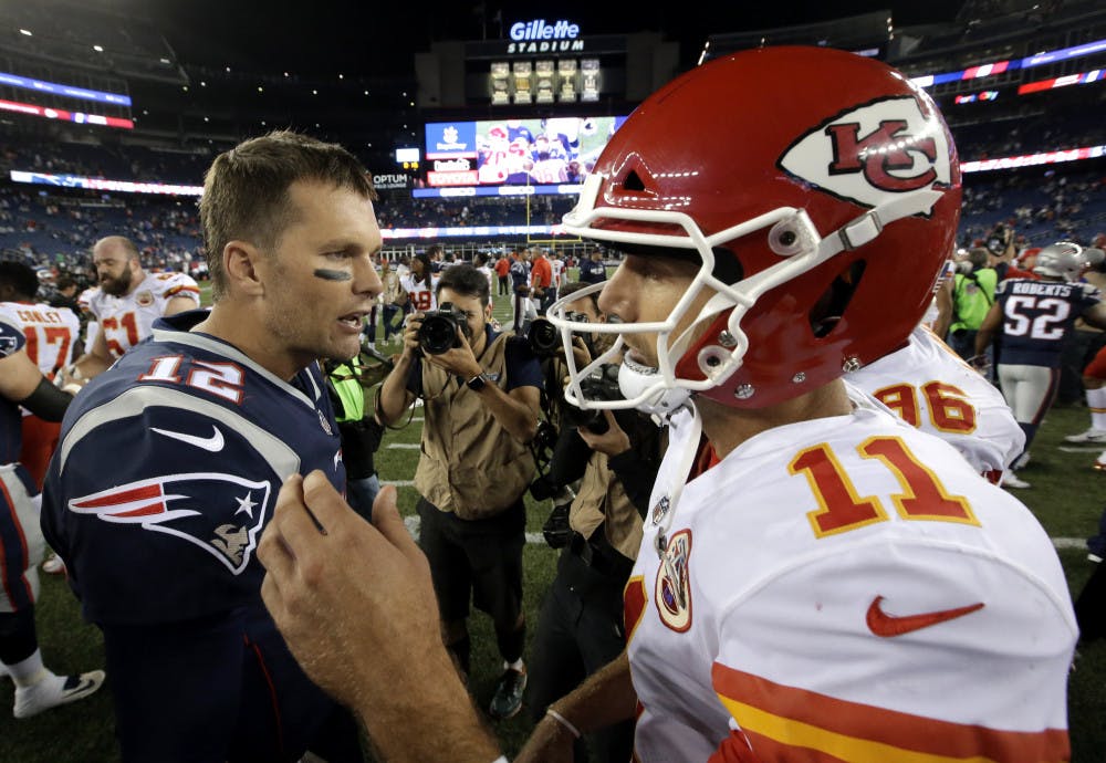 <p>New England Patriots quarterback Tom Brady, left, and Kansas City Chiefs quarterback Alex Smith, right, speak at midfield after an NFL football game, early Friday, Sept. 8, 2017, in Foxborough, Mass. (AP Photo/Steven Senne)</p>