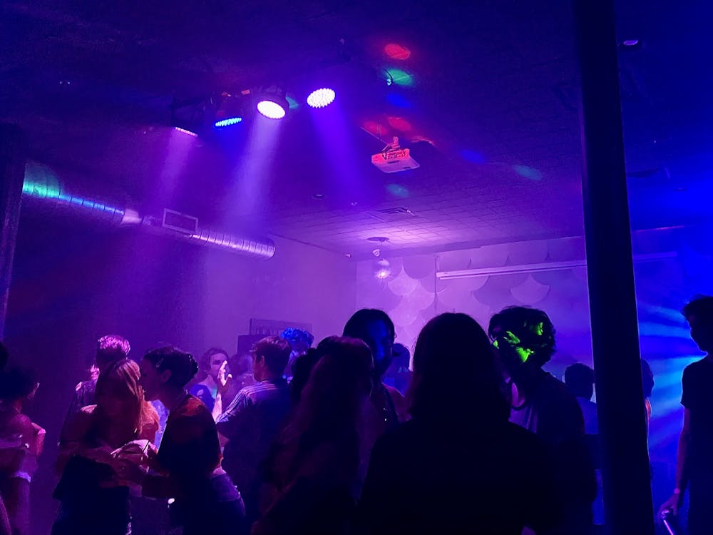 <p>Patrons gather on the strobe-lit dance floor during The Wooly&#x27;s SOPHIE tribute, held Oct. 15.</p>
