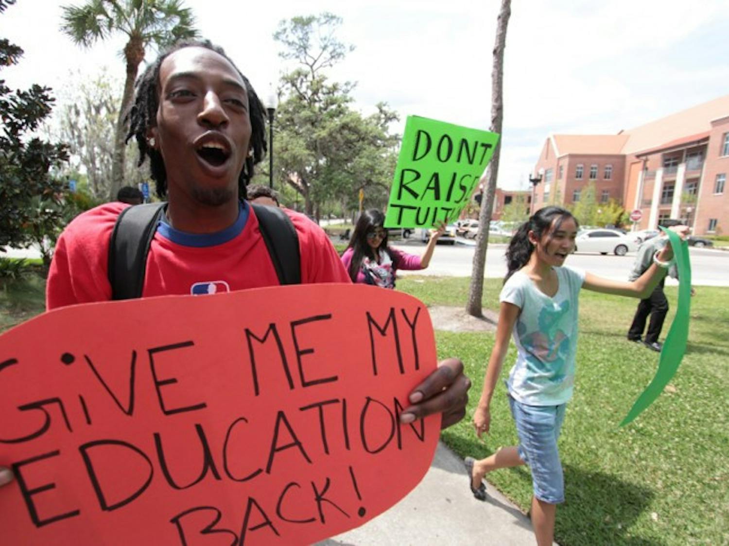 Students for a Democratic Society activist Jarrod Allen, 22, marches to Tigert Hall on Thursday afternoon to protest SB 1752, which would increase tuition.