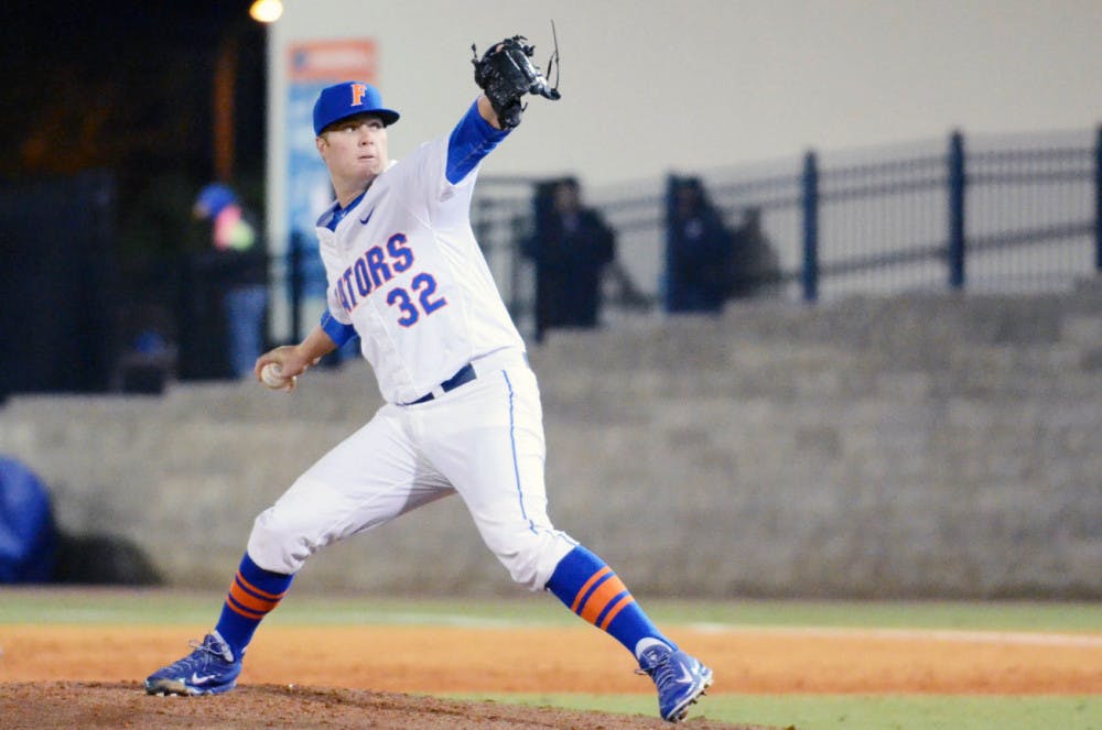 Logan Shore (32) pitches during Florida's 9-1 win against Rhode Island at McKethan Stadium.