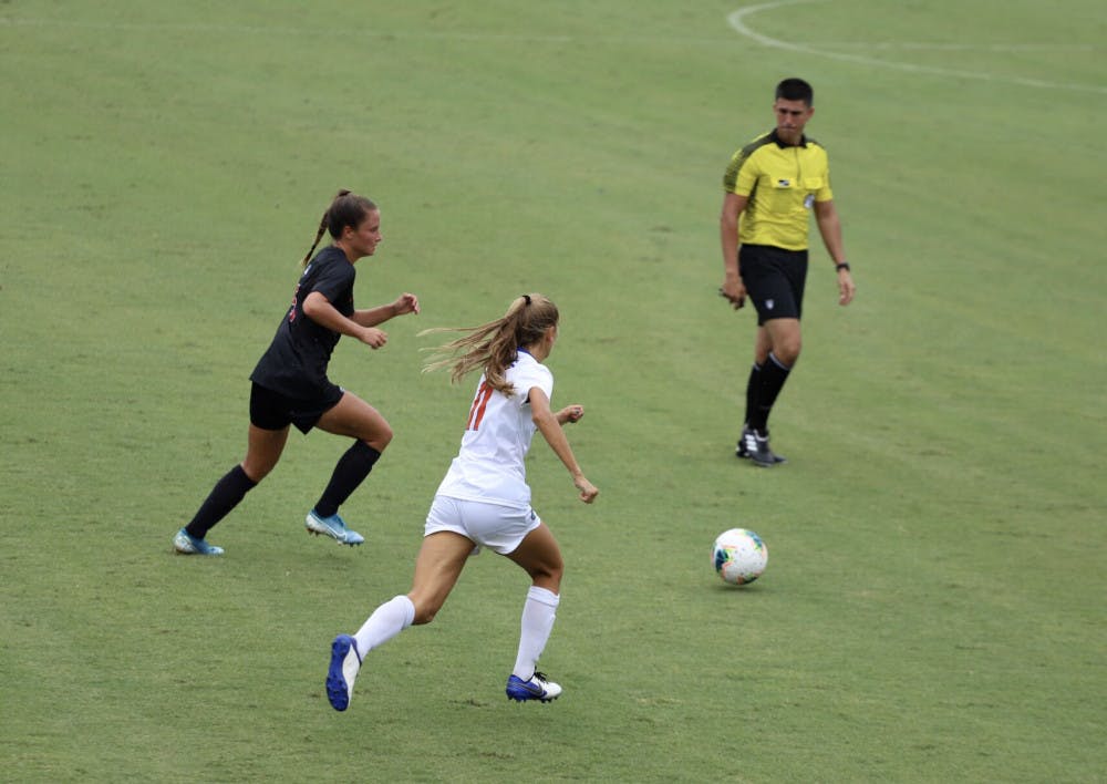 <p><span id="docs-internal-guid-a05bbfc4-7fff-b410-1572-d9f42d1bc2e2"><span>Redshirt freshman midfielder Nicole Vernis fights for a ball at Florida’s home opener against Georgia this season. Vernis scored her first collegiate goal versus South Carolina Sunday afternoon.</span></span></p>