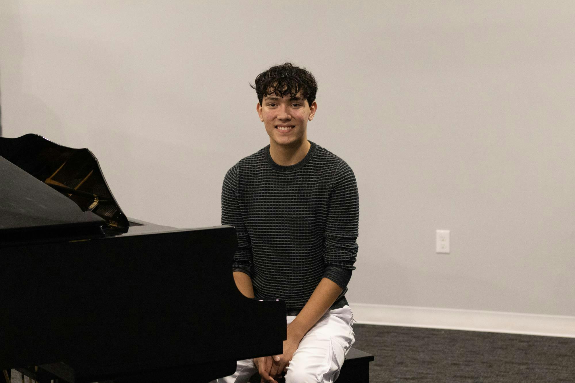 Owner and founder of Ripple Theatre Nathan Wynn poses at his piano, Tuesday, Sept. 22, 2026, in Gainesville, Fla.