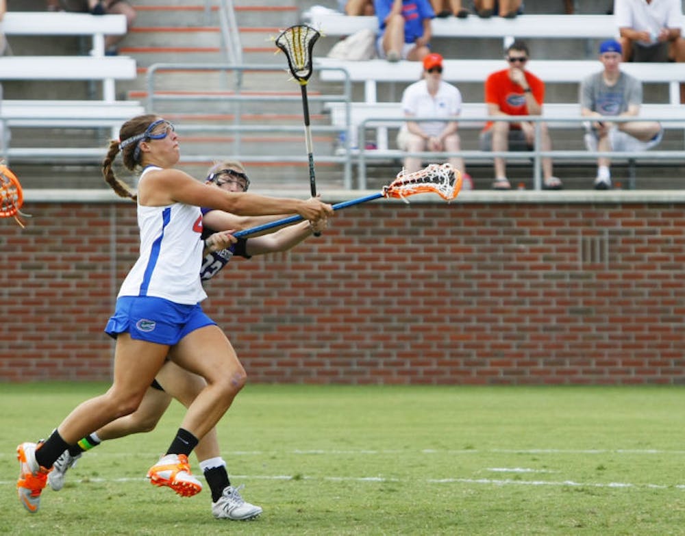 <p>Senior Kitty Cullen attempts a shot during Florida’s 14-7 win against Northwestern in the ALC Championship Game on May 5, 2012, at Dizney Stadium. Cullen said teammate Ashley Bruns could beat any defender when Bruns attacks from the crease.</p>