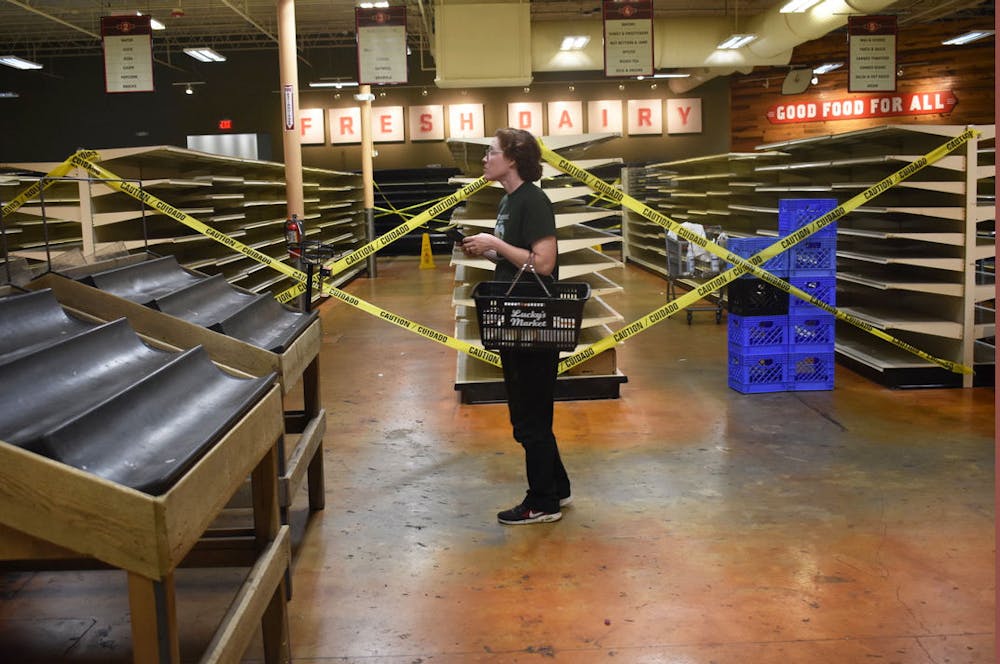 <p>A Lucky’s Market customer shops as the store’s closing approaches. The store is officially closing on Feb. 12.</p>