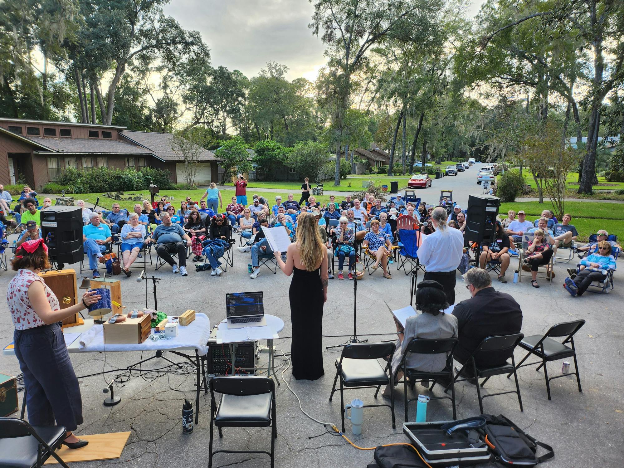 Members of the Driveway Theatre Project perform a radio play with a foley artist to create live sound effects.