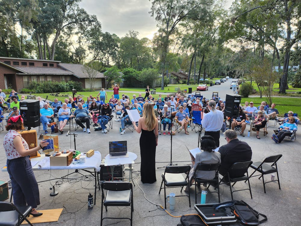 <p>Members of the Driveway Theatre Project perform a radio play with a foley artist to create live sound effects.</p>