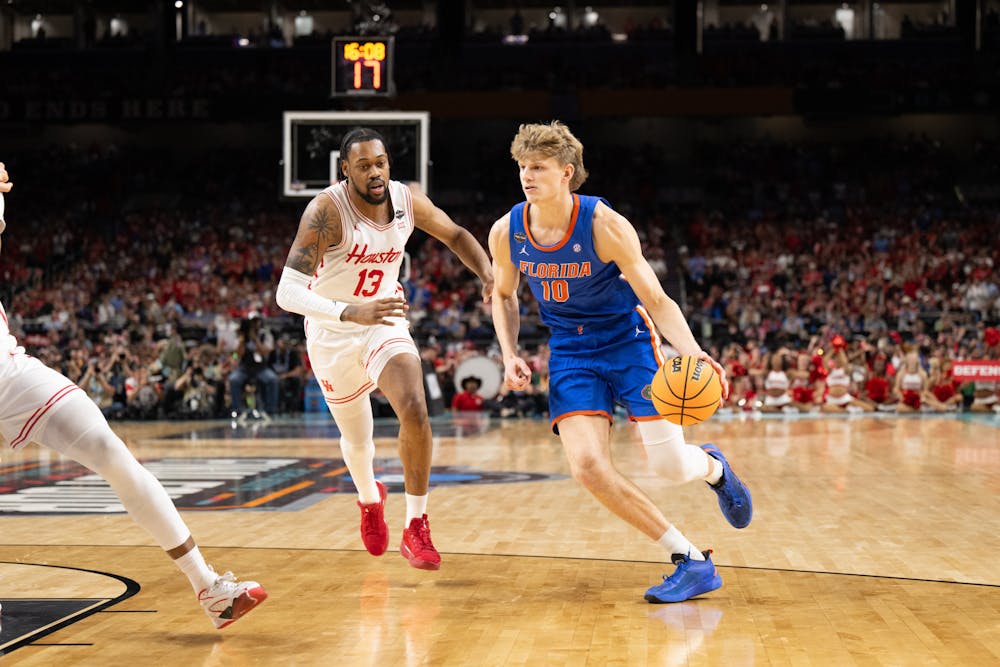 Florida Gators forward Thomas Haugh (10) drives with the ball during a basketball game against the Houston Cougars in the National Championship round of the NCAA Tournament on Monday, April 7, 2025, in San Antonio, Texas.
