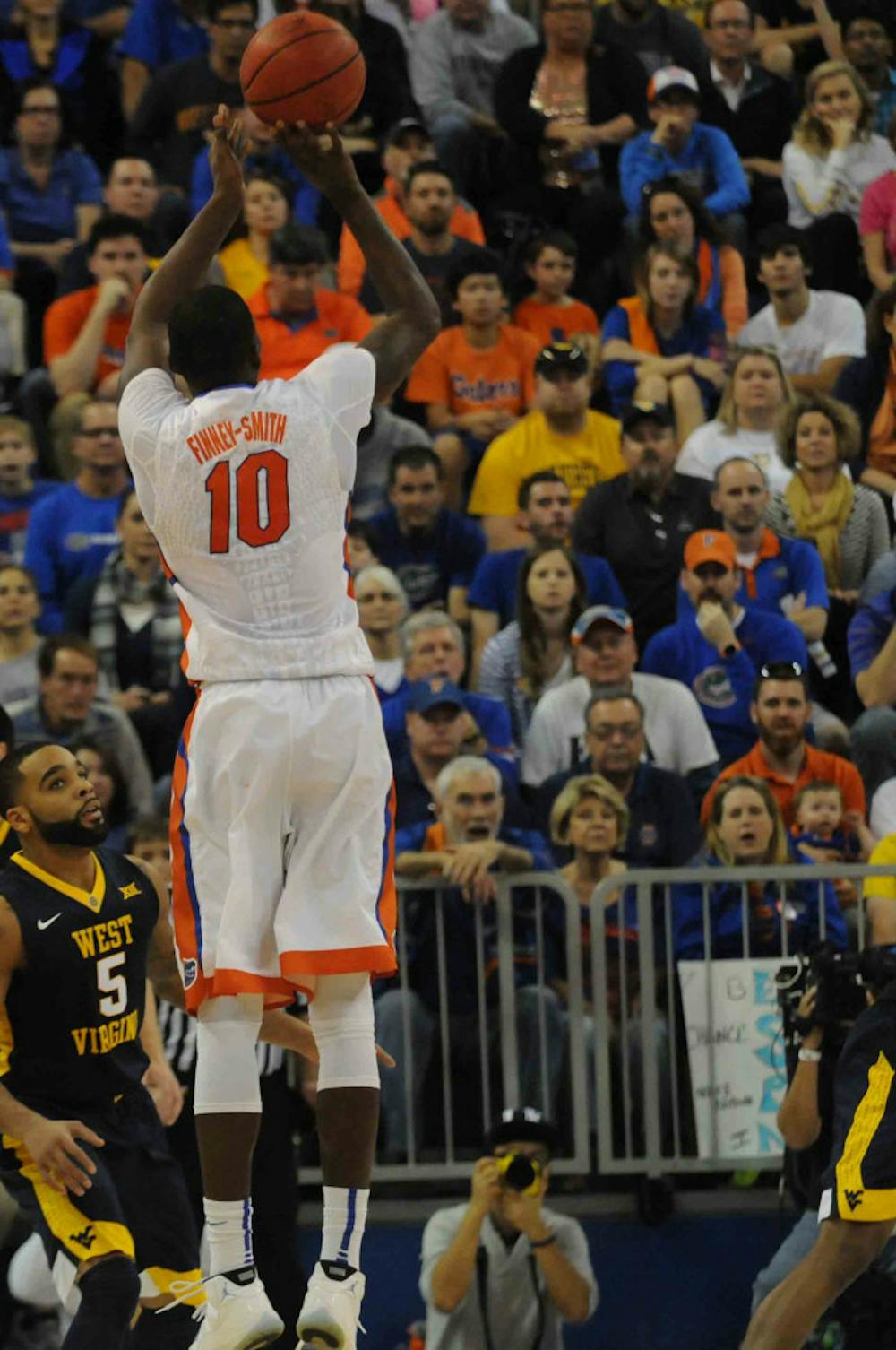 <p>Dorian Finney-Smith attempts a three-pointer during Florida’s win over West Virginia on Jan. 30, 2016, in the O’Connell Center.</p>
