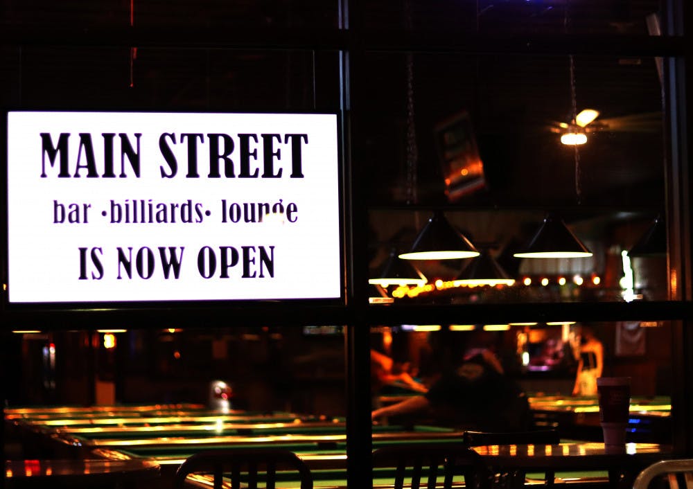 People are seen playing pool inside of Main Street Bar and Lounge on Sept. 14, 2020. Bars in Florida, except for Miami-Dade may now open at 50% occupancy. 