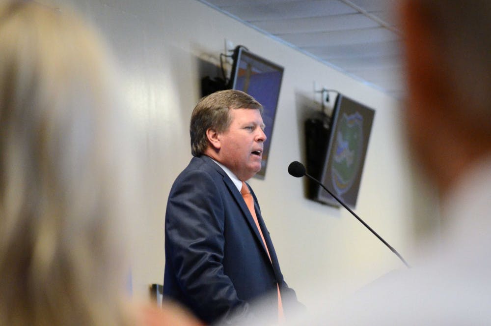 <p>New head football coach Jim McElwain speaks at his opening press conference in Ben Hill Griffin Stadium.</p>