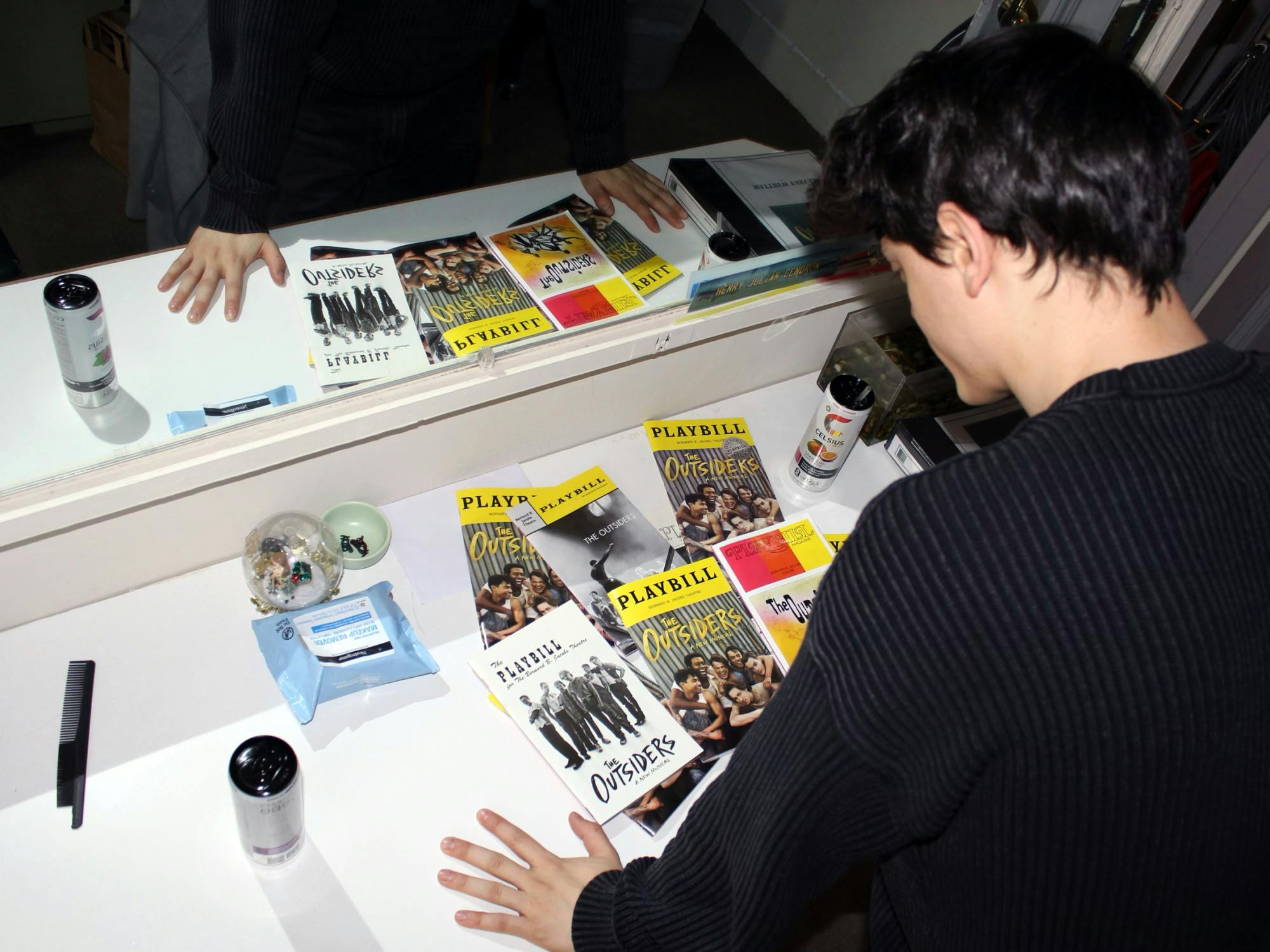 Trevor Wayne gazes at a collection of playbills in his dressing room at the Bernard B. Jacobs Theatre in New York, New York on Thursday, Dec. 19, 2024. 