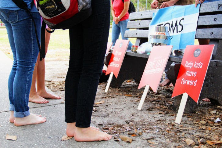 UF students ditch their shoes Tuesday for TOMS One Day Without Shoes event to raise awareness of people in foreign countries who don't own any shoes. Students were asked to go the entire day without wearing shoes.