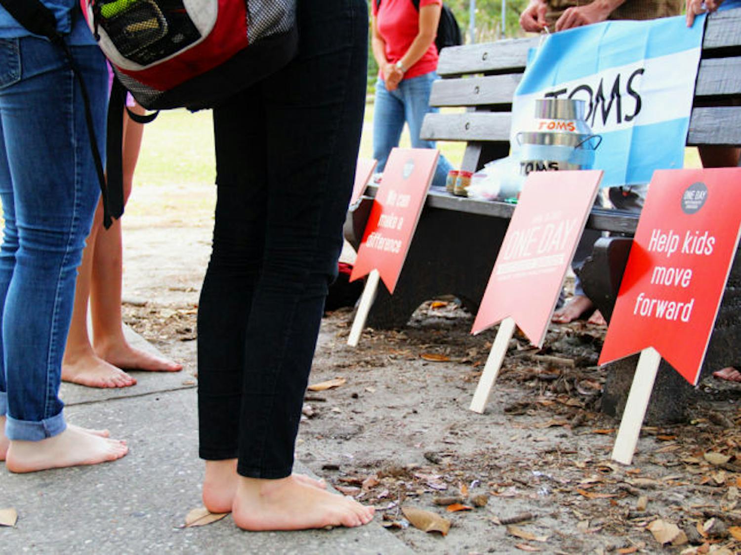UF students ditch their shoes Tuesday for TOMS One Day Without Shoes event to raise awareness of people in foreign countries who don't own any shoes. Students were asked to go the entire day without wearing shoes.