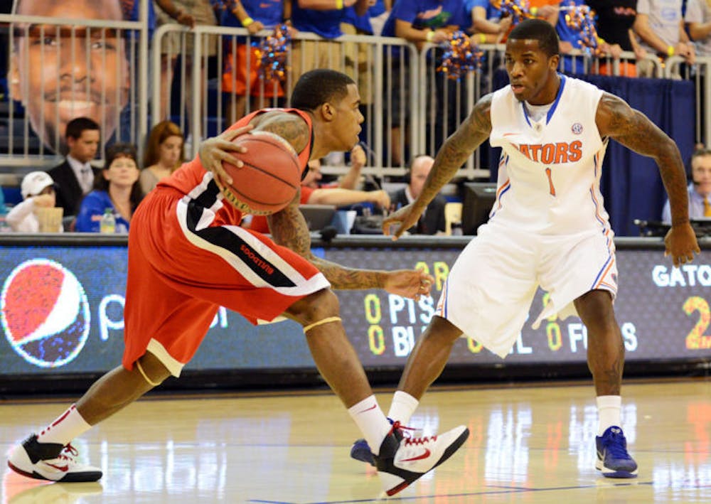 <p>Senior Kenny Boynton defends Georgia guard Vincent Williams during Florida’s 77-44 win on Jan. 9 in the O’Connell Center. UF’s defense will be tasked with stopping Texas A&amp;M’s Elston Turner tonight at 7.</p>