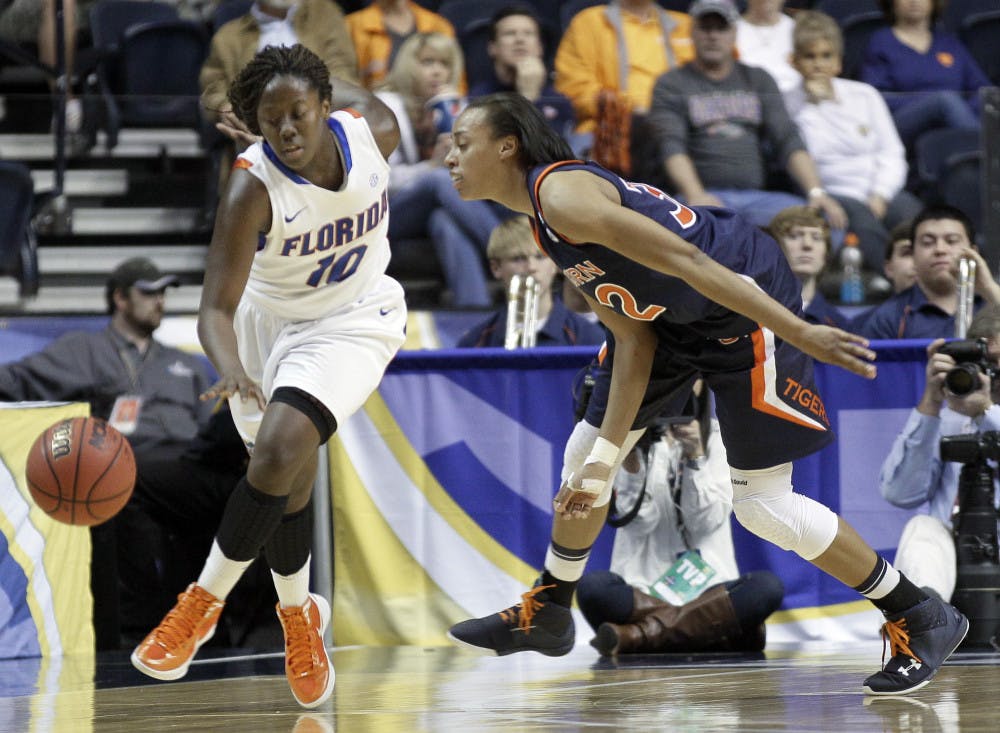 Florida guard Jaterra Bonds (10) gets past Auburn defender Tyrese Tanner, right, in the second half of the Gators' 70-60 win Thursday in the first round of the women's Southeastern Conference Tournament. 