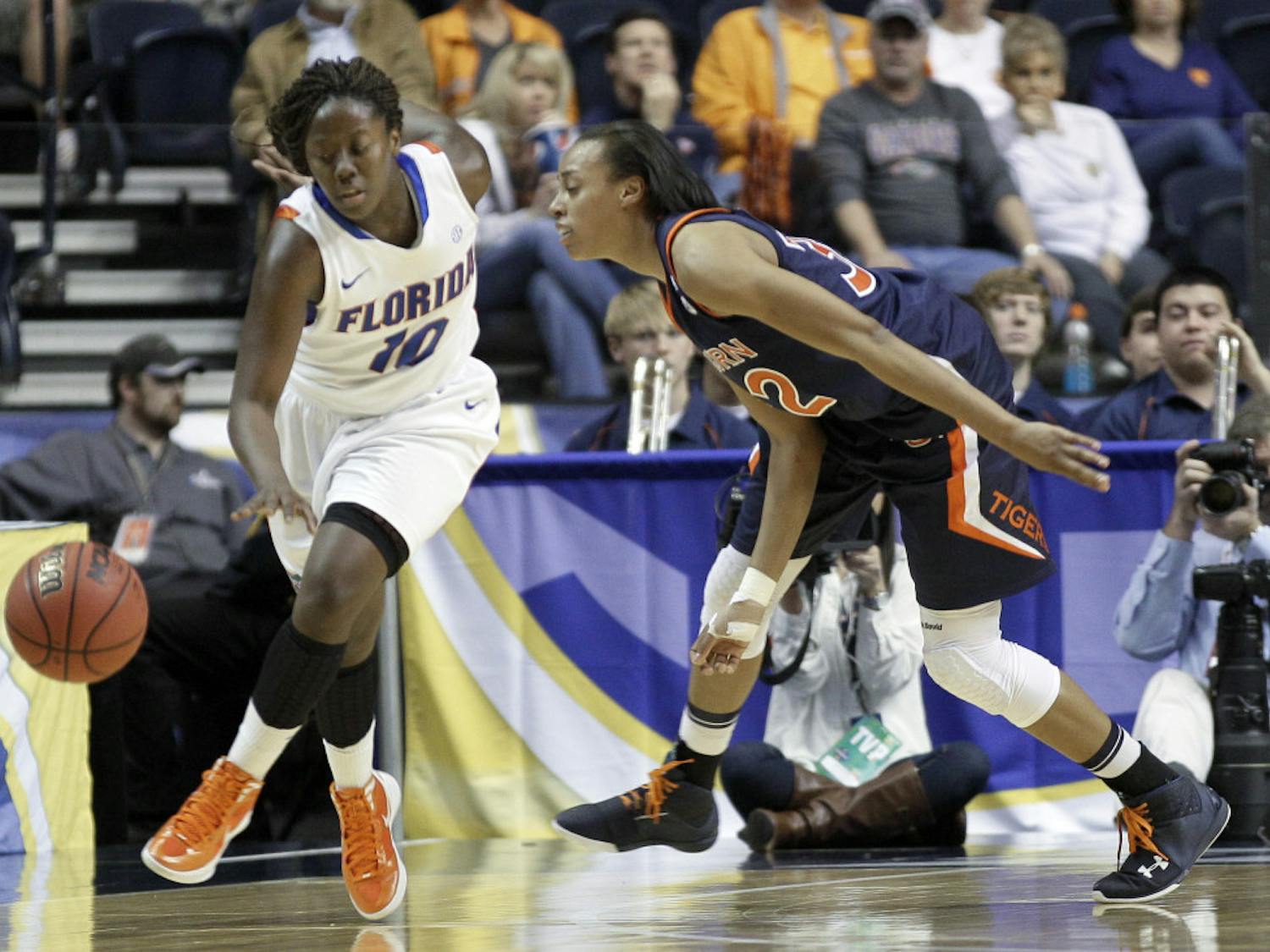 Florida guard Jaterra Bonds (10) gets past Auburn defender Tyrese Tanner, right, in the second half of the Gators' 70-60 win Thursday in the first round of the women's Southeastern Conference Tournament. 
