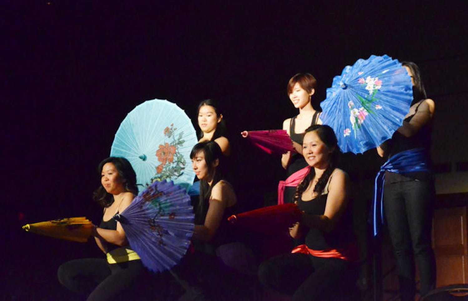 Members of the Chinese Asian Student Association perform the Umbrella dance, a traditional Chinese dance, at the Chinese New Year Festival 2013: Enter the Unknown in the Reitz Union Grand Ballroom on Saturday.