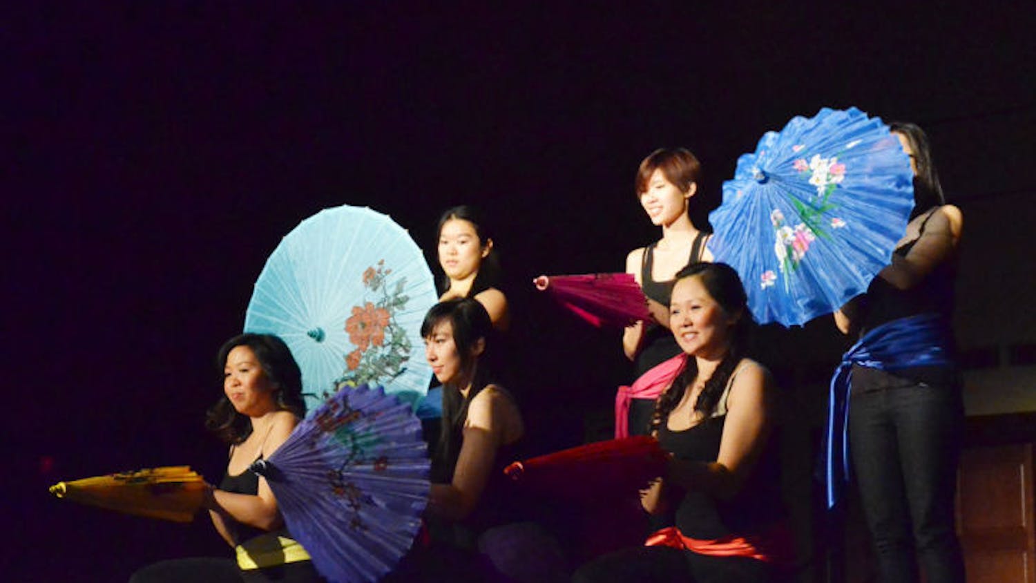 Members of the Chinese Asian Student Association perform the Umbrella dance, a traditional Chinese dance, at the Chinese New Year Festival 2013: Enter the Unknown in the Reitz Union Grand Ballroom on Saturday.