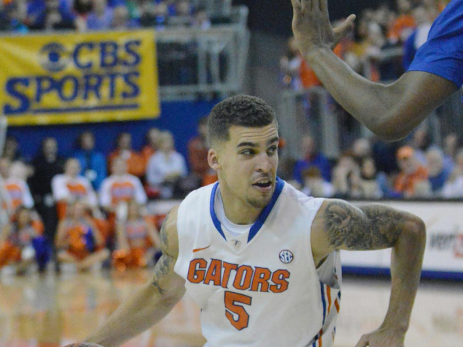 Scottie Wilbekin drives down the court during Florida’s 84-65 win against Kentucky on Saturday in the O’Connell Center.