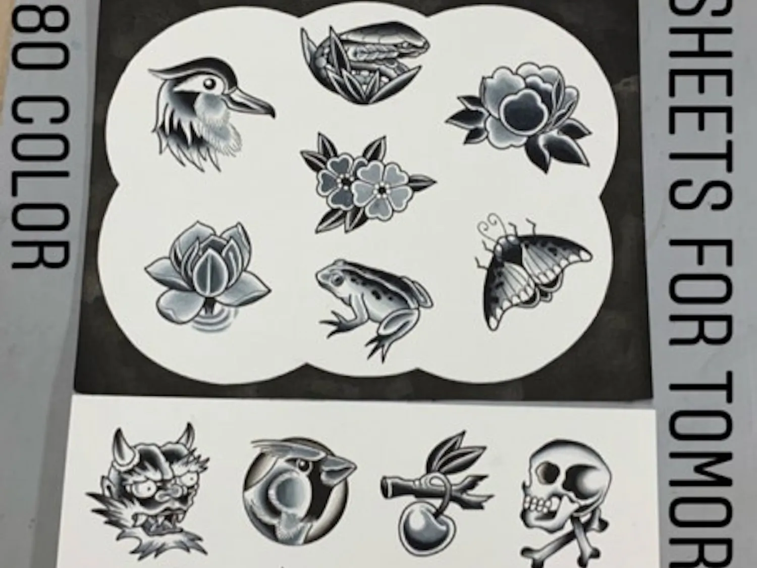 Tattoo artist Tim Strating displays his flash sheets for Anthem Tattoo's Friday the 13th event.