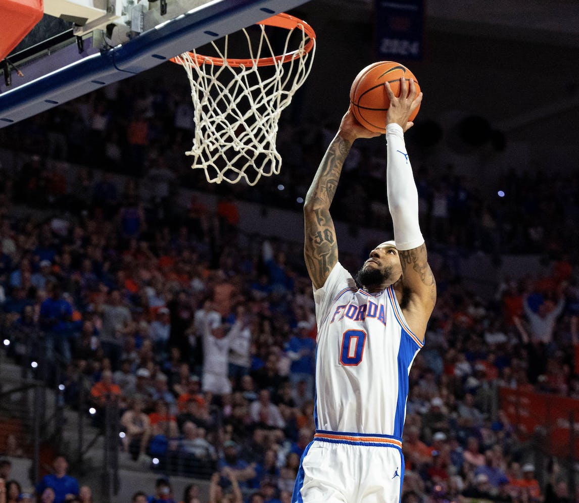 Florida guard Boogie Fland (0) dunks during the first half of an NCAA college basketball game against Kentucky, Saturday, Feb. 14, 2026 at Exactech Arena in Gainesville, Fla.