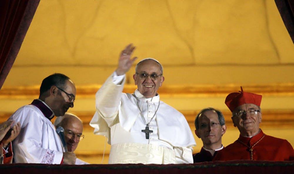 <p>Pope Francis I waves from the central balcony of St. Peter’s Basilica at the Vatican on Wednesday. Cardinal Jorge Mario Bergoglio, who chose the papal name of Francis, is the 266th pontiff of the Roman Catholic Church.</p>