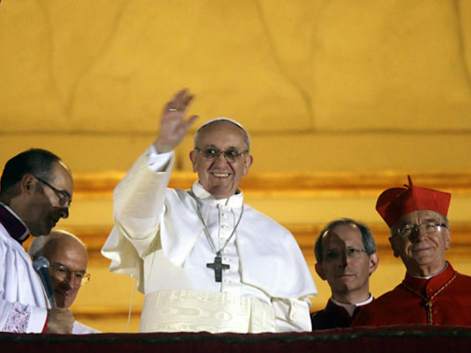 Pope Francis I waves from the central balcony of St. Peter’s Basilica at the Vatican on Wednesday. Cardinal Jorge Mario Bergoglio, who chose the papal name of Francis, is the 266th pontiff of the Roman Catholic Church.