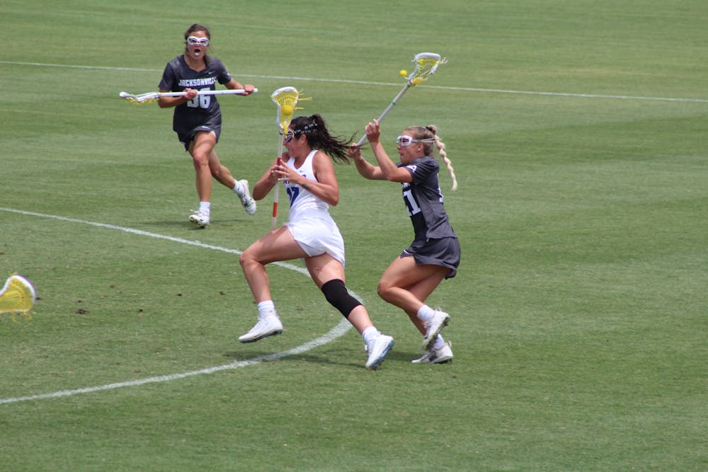AAC Midfielder of the Year Shannon Kavanagh runs through the Jacksonville defense on May 16. Kavanagh and the Gators face Syracuse for a trip to the Final Four Saturday.