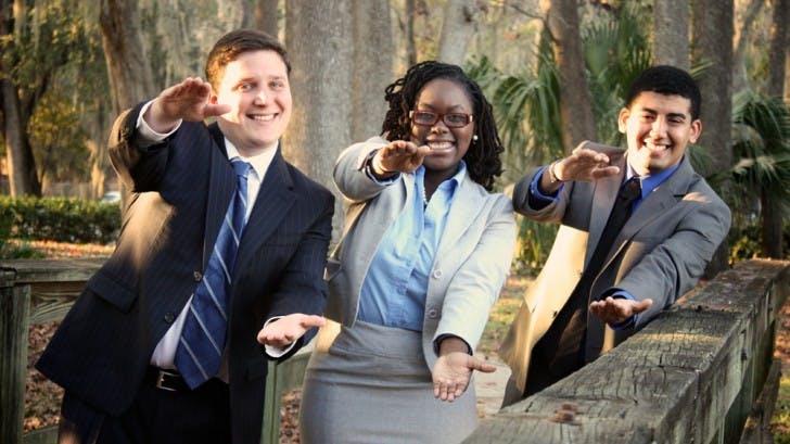 Unite Party executive candidates, Tj Villamil, Sabine Justilien and Juan Rodriguez, pose for a campaign photo.